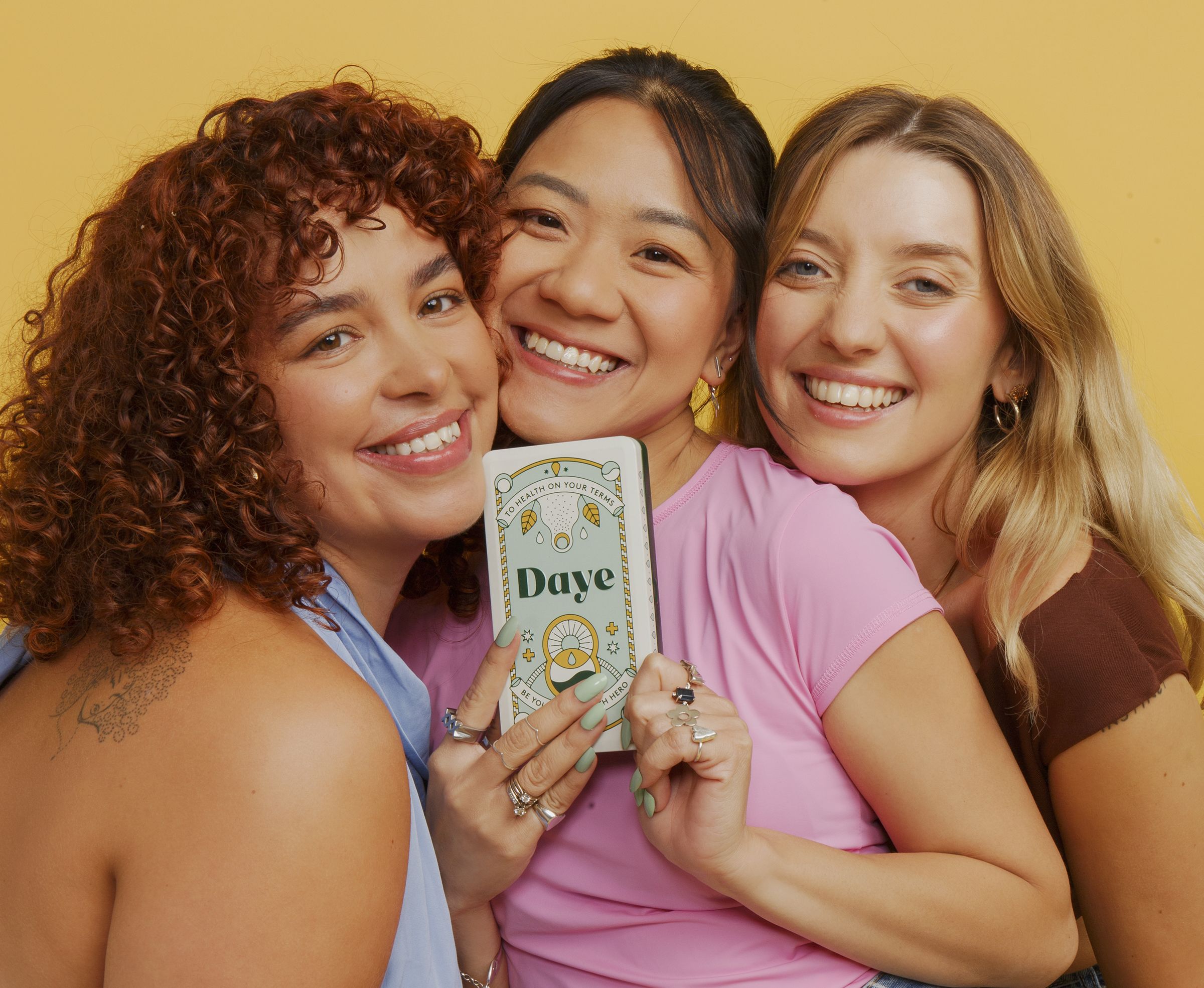 Young women holidng boxes of Daye products