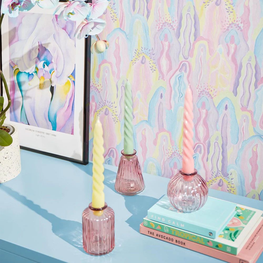 Styled shot of mantelpiece with Lust Home vulva wallpaper